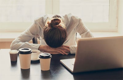 photo of working woman feeling fatigue