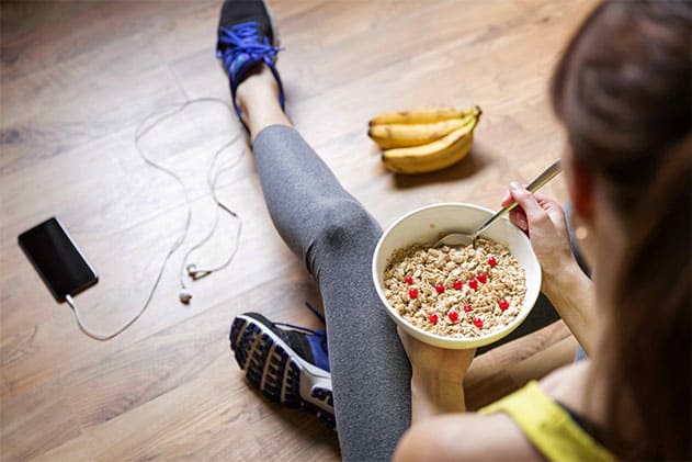 Photo of woman eating breakfast